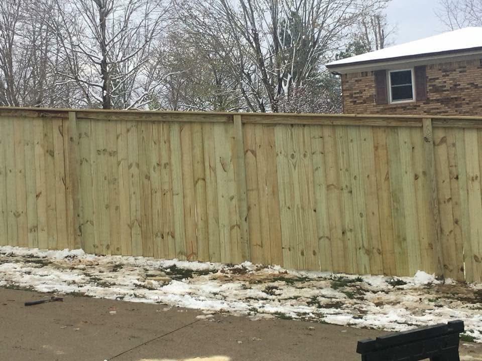 Privacy fence corner with posts set in grade